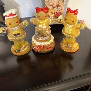 Gingerbread boy and girl with a music box gingerbread girl.